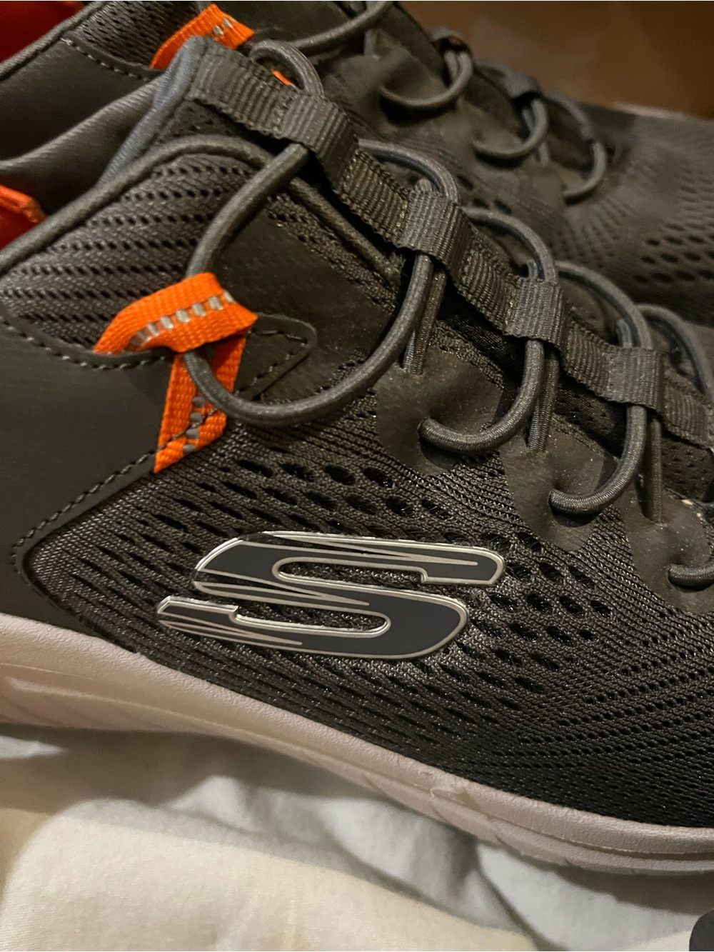 Skechers Men’s Black Sneakers with Orange Accents